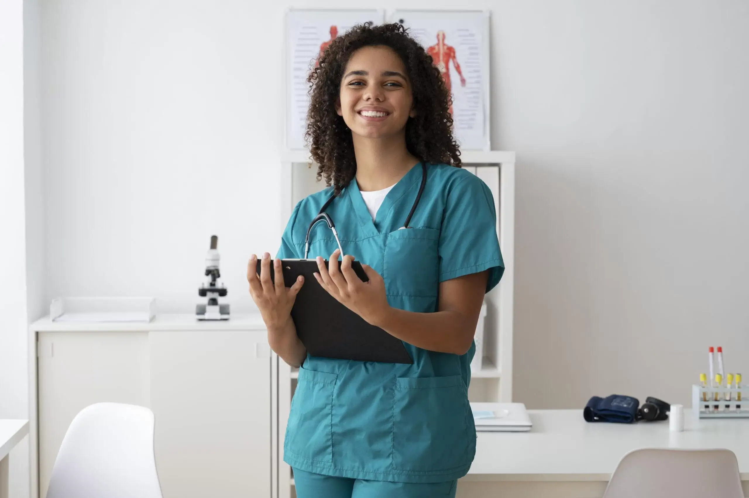 A Travel Nurse in scrub holding clipboard
